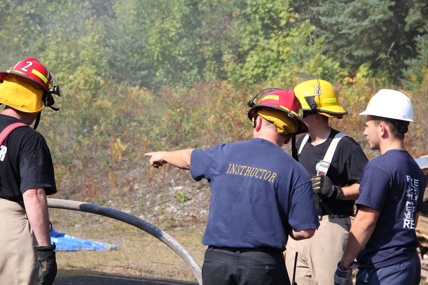 Instructor pointing out the fire ground to trainees